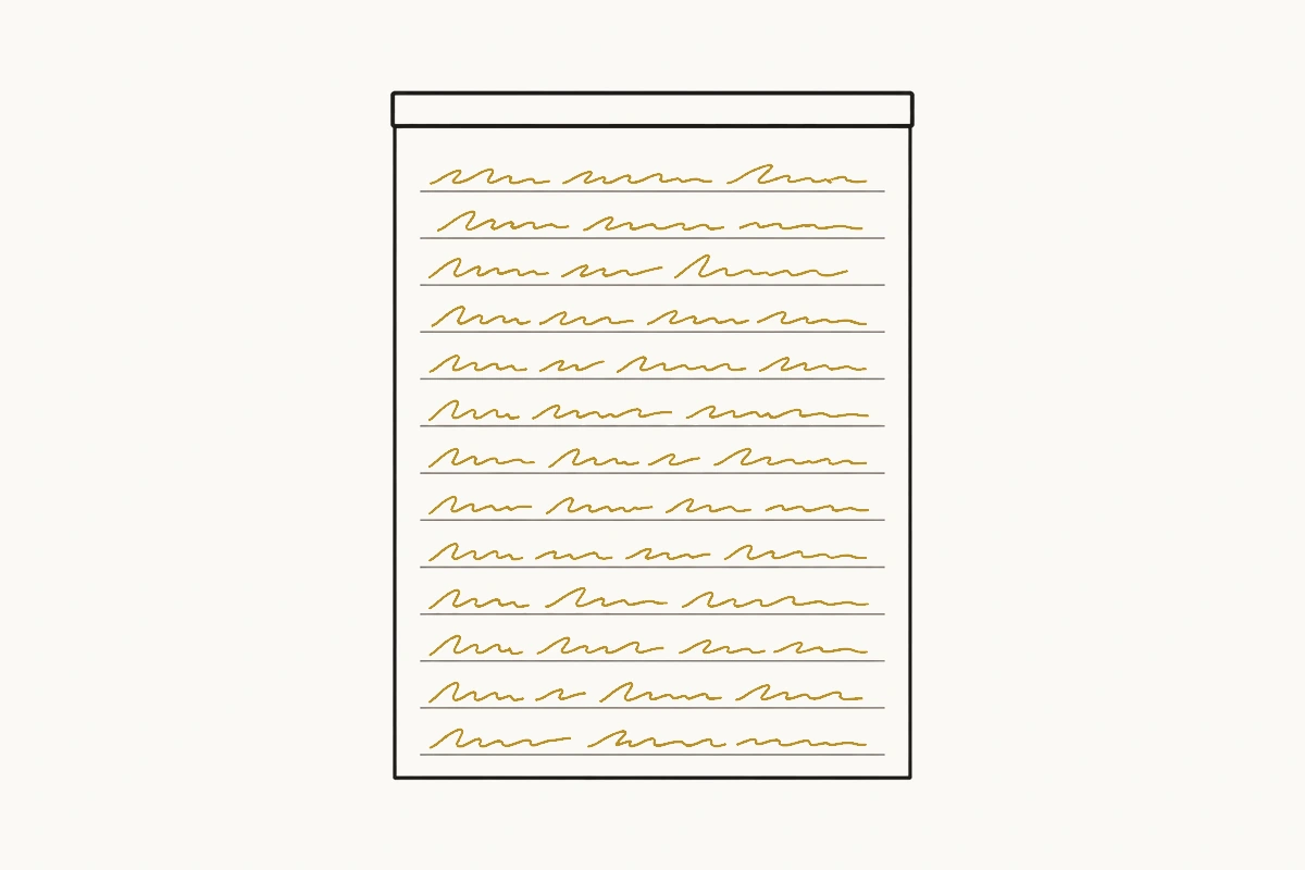A prescription pad with the top sheet fully written on and still attached along its bound edge.