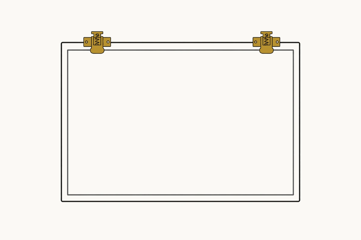 A radiographic film viewing box mounted on a wall, its two film clips empty and its panel blank.